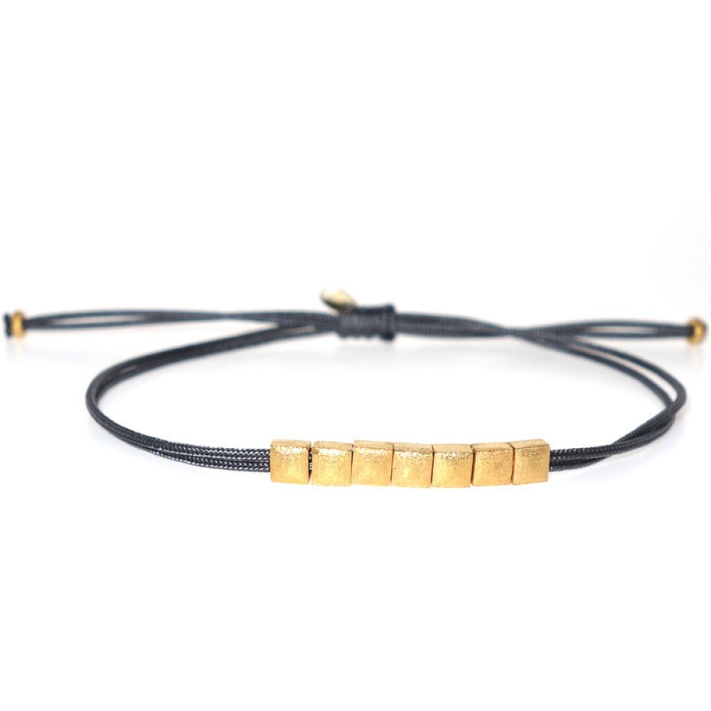 Gold 9ct. Seven square bead bracelet on cord