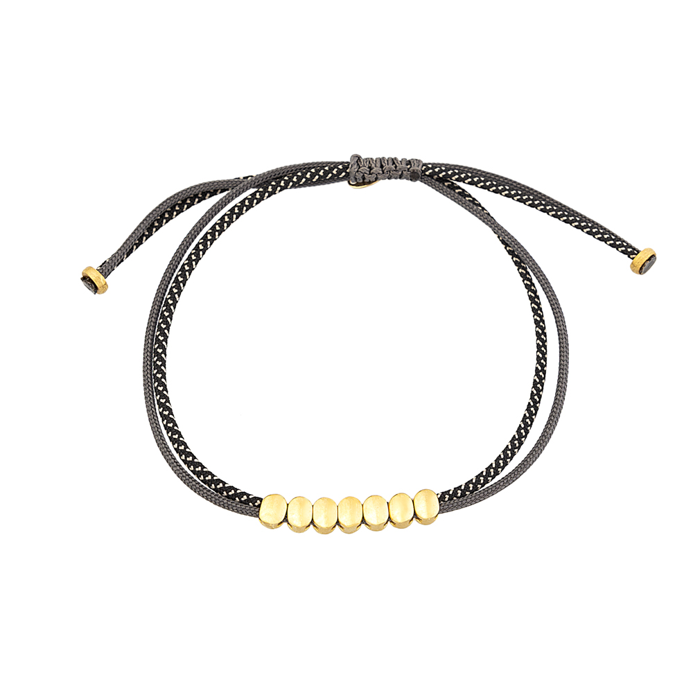 9kt Gold. Seven oval bead bracelet on cord